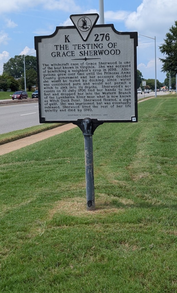 A Virginia historical plaque that is placed next to a busy highway.