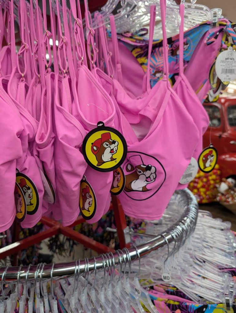 A pink bikini top with the Bucc-ee's logo on it