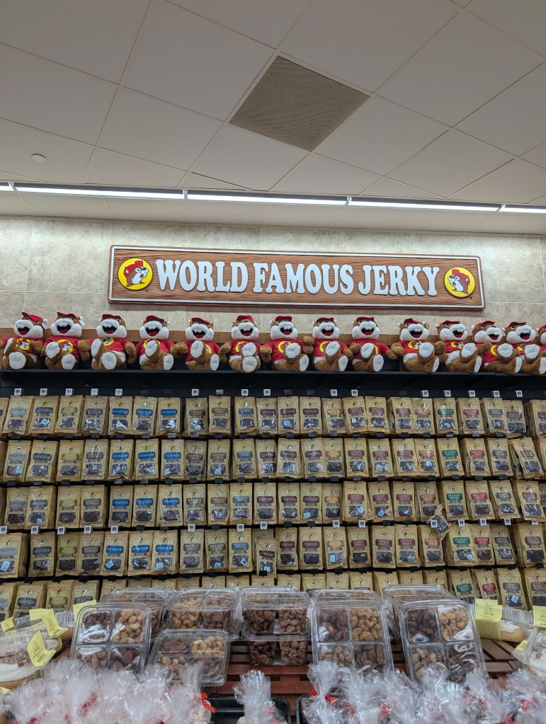 A wall full of packages of beef jerky. A sign reads "World Famous Jerky".