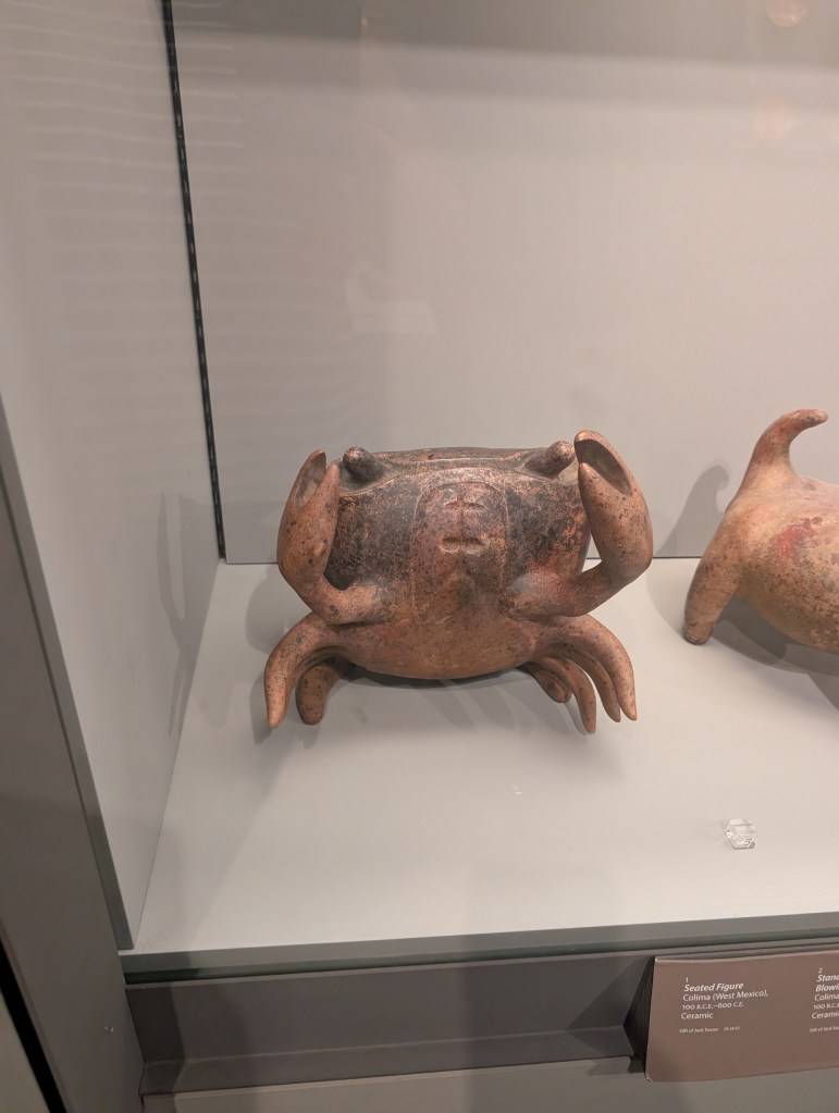 A terracota pot shaped like a crab with his little claws raised. He's the best.